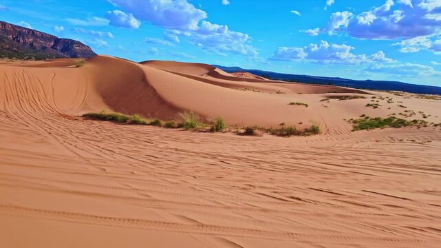 ATV rides through Coral Pink Sand Dunes State Park at sunset