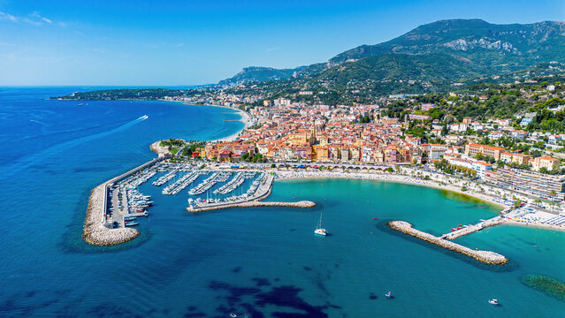 Aerial drone view of the old port of Menton on the coast of the Mediterranean Sea in the French Riviera