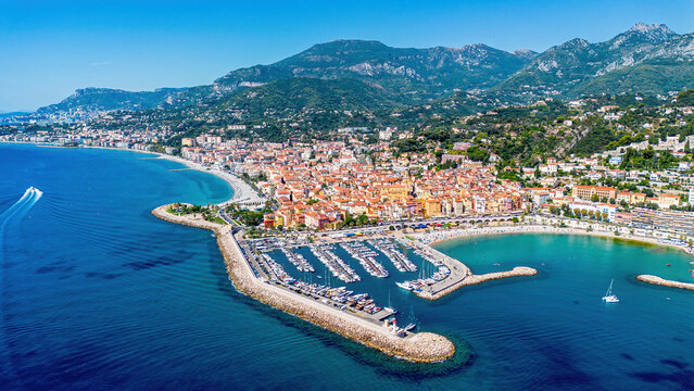 Aerial drone view of the old port of Menton on the coast of the Mediterranean Sea in the French Riviera