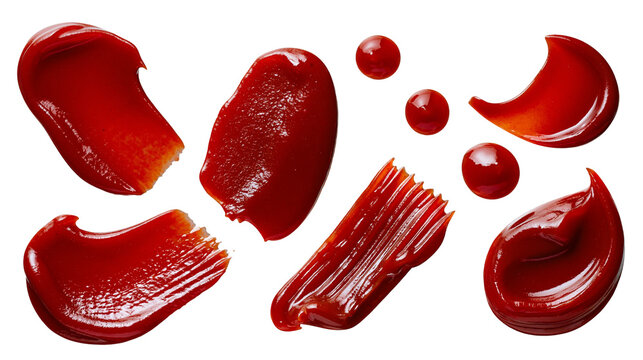 Isolated set of vibrant red ketchup and tomato sauce drops, splatters, streaks, and smears.