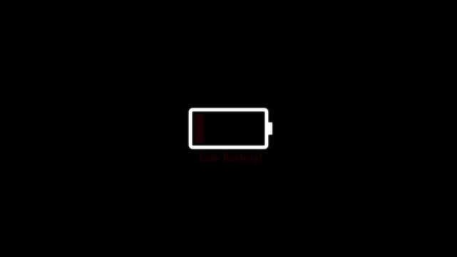 Low battery power indicator ikon loop animation. ideal for digital and tech-themed projects on a Black background.