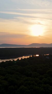 FKK Naturist Baldarin Campsite In Punta Kriza On Cres Island, Croatia, Filmed By Drone During A Beautiful Summer Evening. Aerial Views Show Campervans, Motorhomes, Coastal Nature at Sunset
