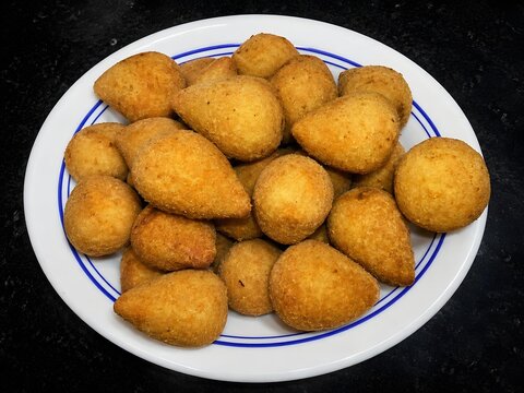 Traditional Brazilian Coxinha Fried Chicken Snacks Served on White Plate