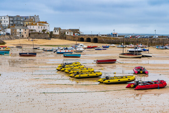 St Ives, Cornwall, UK - 15th June 2026.
Low tide at St Ives Harbour beach with boats grounded on the sand.