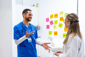 Doctors collaborating on medical concepts strategy in hospital