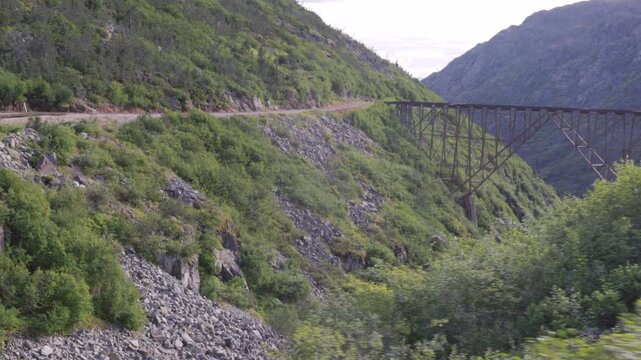 a wide view of abandoned dead horse gulch bridge from the white pass & yukon route railway at alaska of the usa