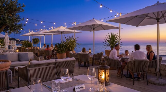 Romantic Beachfront Terrace Dining at Sunset with Lantern and Reserved Table