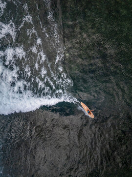 Overhead view of Surfer on longboard