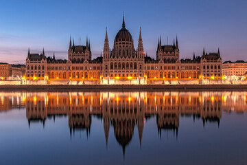 Fototapeta premium Hungarian Parliament building in Budapest. Reflections of the Budapest Parliament Building on the banks of the Danube River.