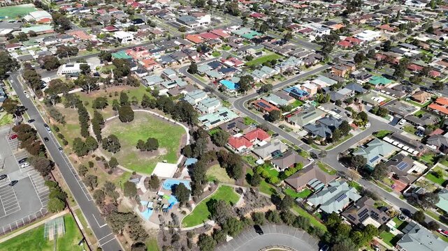 Aerial view showing a community park with playgrounds,&nbsp;car parking, and surrounding suburban housing estates in Hoppers Crossing, Melbourne, Australia.