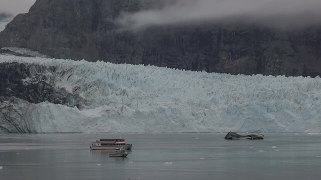 a pan of margerie glacier and cruise boats at glacier bay of alaska. usa