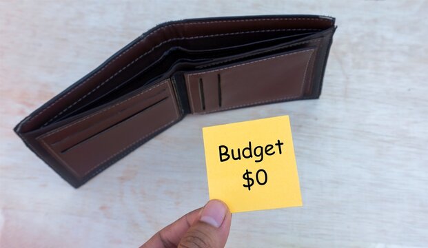 Budget Zero Sticky Note with Empty Wallet Financial Concept, illustrating no available funds, strict budgeting, and financial limitations.