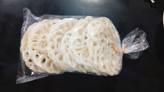 Traditional Indonesian White Tapioca Crackers Packaged in a Clear Plastic Bag