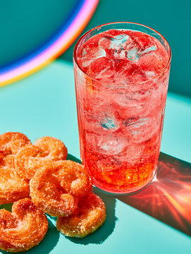 Palmier cookies were placed next to the strawberry soda