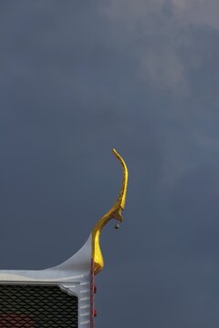 Chofas (distinctive features of Thai temple architecture), pointed roof decorations, stormy sky, ubosot (ordination hall), Wat Chana Songkhram, Phra Nakhon, Bangkok, Thailand