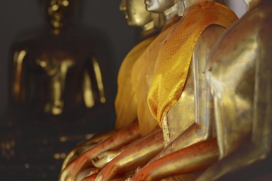 Gilded Buddha statues (Bhumispara-mudra: Gautama Buddha at the moment of enlightenment), Wat Suthat Thepwararam, Royal Temple, Phra Nakhon, Bangkok, Thailand