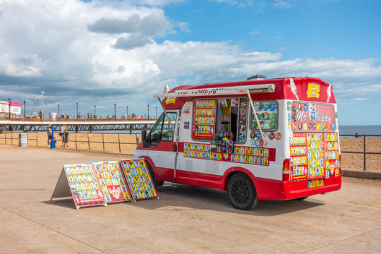 An ice cream van parked at the end of the promenade next to Skegness beach in Lincolnshire, UK