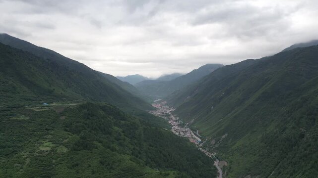 Clouds hanging above a remote mountain valley in western China