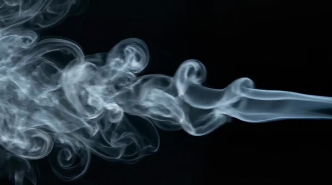 White smoke swirling against black background