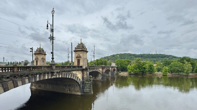 The Legion Bridge over the river with reflection in Prague, Czechia