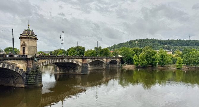 The Legion Bridge over the river with reflection in Prague, Czechia