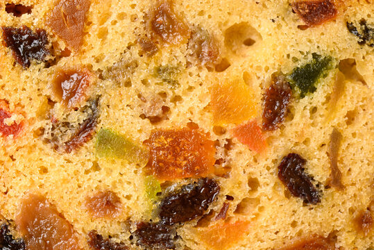 Top view close up texture of traditional Christmas fruitcake with dried fruits