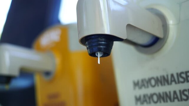  Dispenser Series - Man Uses Buffet Dispenser of Mayonaise at Restauran