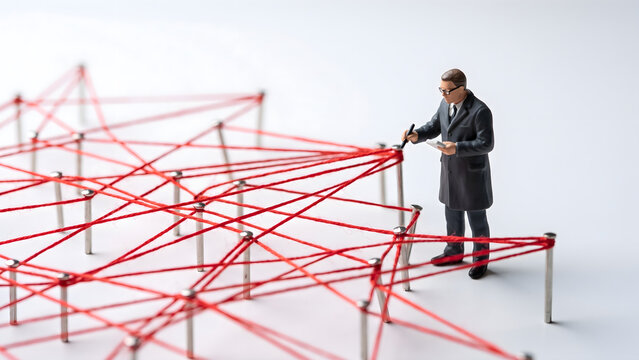 Miniature Figure Analyzing Complex Business Network and Connections