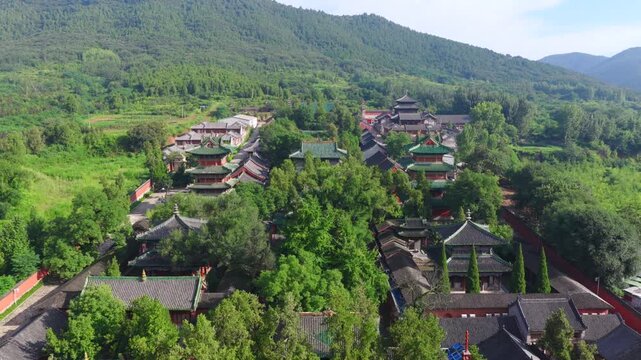Aerial view of Shaolin Temple in morning mist, world cultural heritage in Henan China, birthplace of Zen Buddhism and Shaolin Kung Fu。Chinese civilization，Chinese philosophy