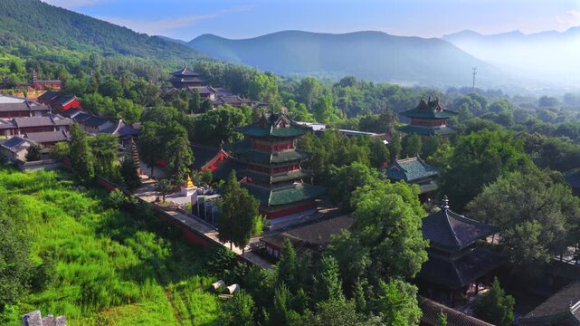 Aerial view of Shaolin Temple in morning mist, world cultural heritage in Henan China, birthplace of Zen Buddhism and Shaolin Kung Fu。Chinese civilization，Chinese philosophy