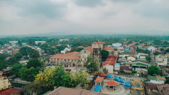 Aerial view of Tayabas Basilica and townscape under a cloudy sky in Quezon Province, Philippines