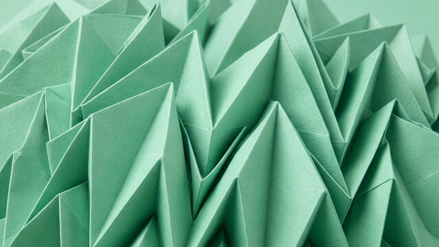 Complex mint green origami tessellation folded paper texture