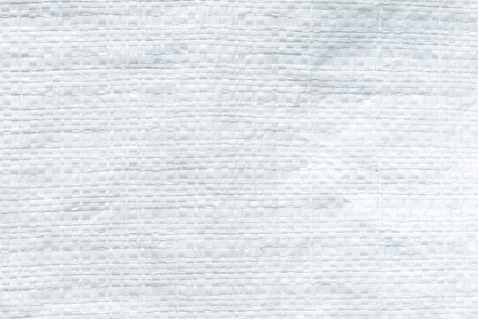 White woven plastic sack texture background, close-up of polypropylene bag material pattern for design and background use,Macro