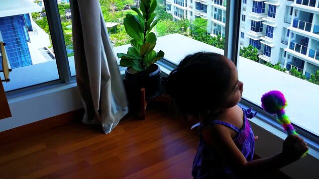 Bangi, Malaysia - December 30, 2019 Cute dancing toddler in the room.