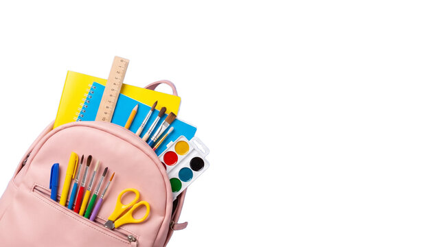 Pink school backpack with colorful stationery, student bag filled with art supplies and notebooks, back to school concept on white background