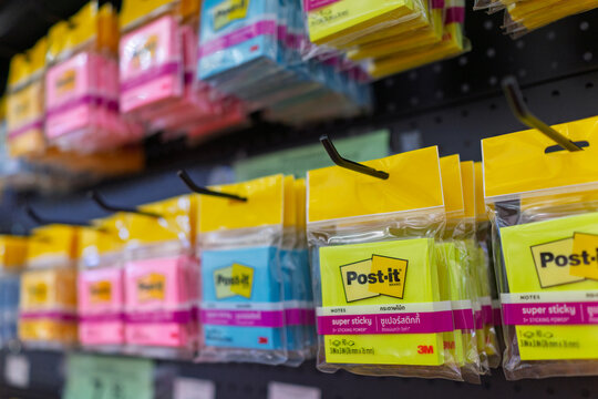 Penang, Malaysia - 8 Aug 2026: Packaged colorful 3M Post-it brand sticky notes, including neon yellow, pink, and blue pads, hanging on retail hooks in a stationery store in Penang.