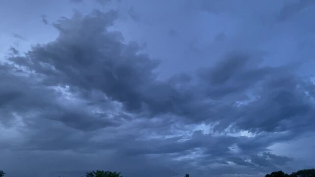 Thick Blue Storm Clouds Rolling Across the Sky Before Rain