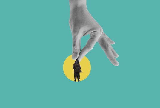 Digital collage art, human hanging on hand in yellow circle
