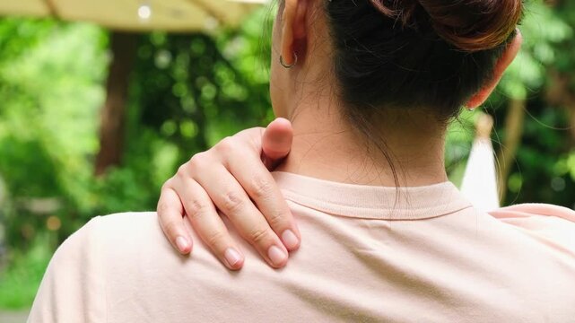 The woman had neck pain, shoulder pain, and Cervical Spondylosis sHe used her hands to massage the pain points of the muscles in her shoulders and neck. Medical concepts and treatments	
