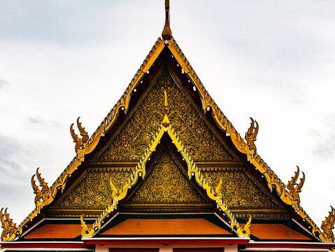 Golden Ornate Thai Temple Roof Gable with Intricate Decoration, Traditional Buddhist Architecture Detail