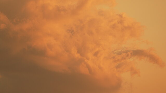 Sunset clouds sky golden hour orange clouds fill the frame during a vibrant evening with copy space