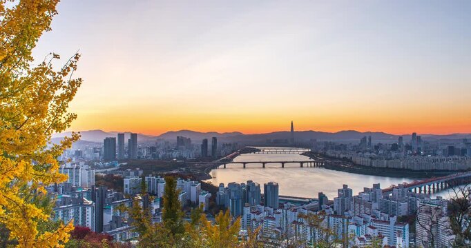 4K time-lapse video the morning scenery and sunrise over Seoul and the Han River in South Korea during autumn.