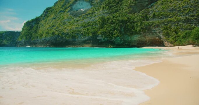 Pristine sandy beach and blue ocean travel inspiration at Kelingking Bali Nusa Penida
