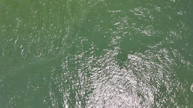 Aerial View of Ocean Water Surface Reflecting Sunlight, Batam, Riau Islands, 4K
