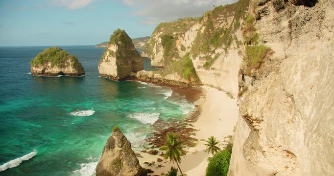 Panoramic view of rocky cliffs and turquoise water at famous tropical Diamond beach in Nusa Penida Bali