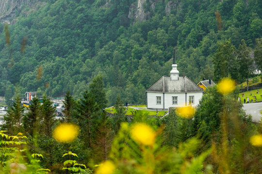 A beautiful white wooden church of Geiranger village in an overcast day. A summer scenery of World Heritage area in Western Norway.