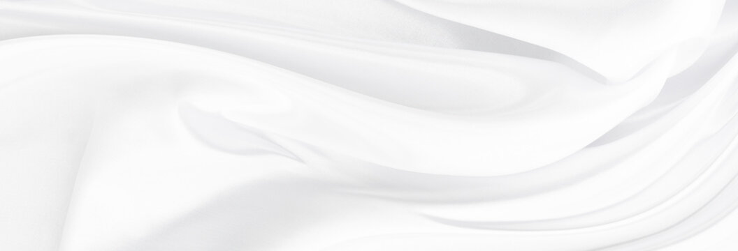 White gray satin texture that is white silver fabric silk background with beautiful soft blur pattern natural.