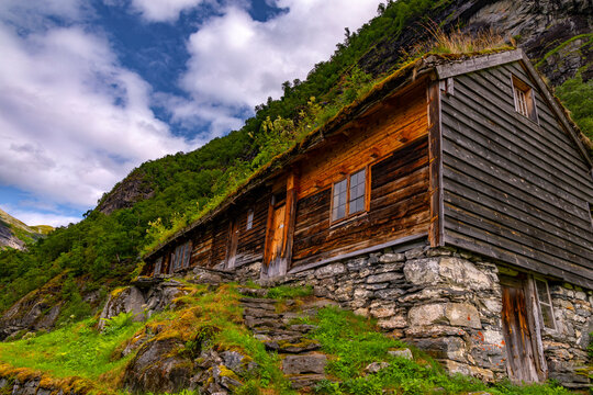A beautiful traditional mountain farm buildings high on the mountain at the Geiranger village. A summer scenery of World Heritage area in Western Norway.