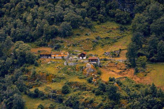 A beautiful traditional mountain farm buildings high on the mountain at the Geiranger village. A summer scenery of World Heritage area in Western Norway.