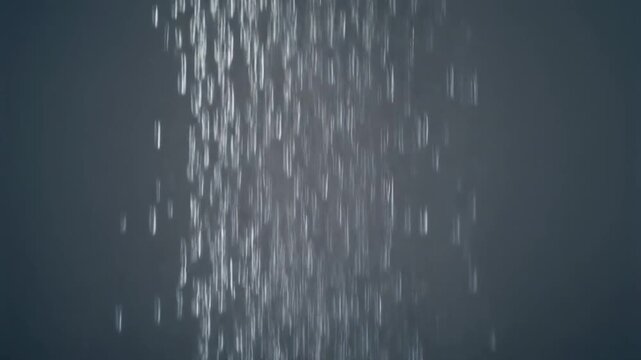 Hyper realistic close up of a single delicate curtain of falling rain water drops in slow motion on a gray background